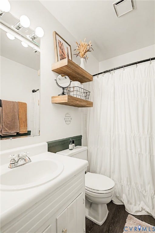 1506 Porters Mill Terrace, Smoketree South, Midlothian, VA 23114 Vanity with integrated sink, wood-finish flooring, two floating shelves, and a white shower curtain