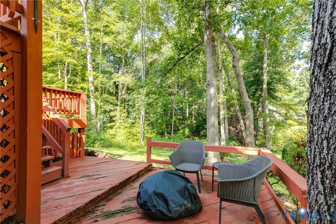 1506 Porters Mill Terrace, Smoketree South, Midlothian, VA 23114 Expansive wood deck with a built-in privacy screen, wood railings, and a multi-level design