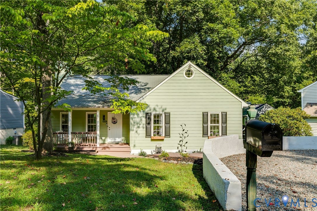 1506 Porters Mill Terrace, Smoketree South, Midlothian, VA 23114 Light green siding with dark shutters, front porch with wood railings, a white front door, and a gravel driveway