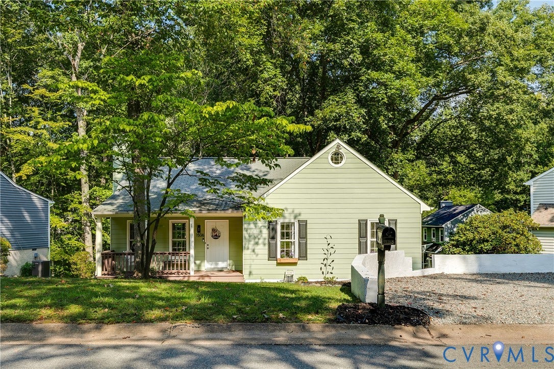 1506 Porters Mill Terrace, Smoketree South, Midlothian, VA 23114 Mint green siding exterior with a front porch, a gravel driveway, and a mature tree canopy