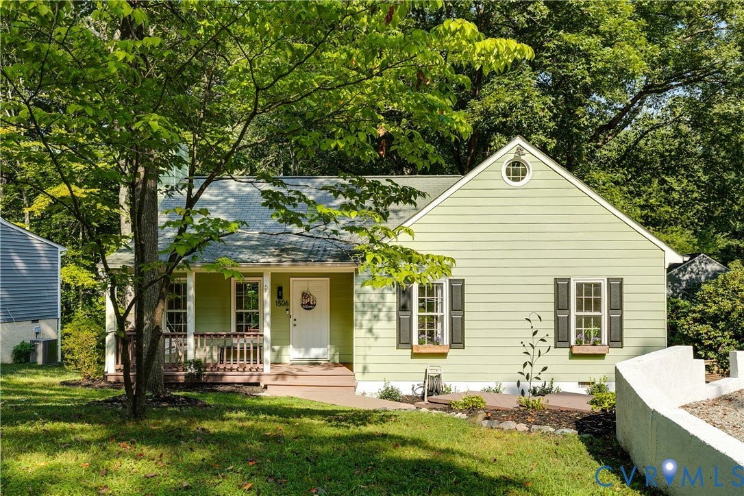 1506 Porters Mill Terrace, Smoketree South, Midlothian, VA 23114 Gabled roofline with a round attic window, light green siding, dark window shutters, and a covered front porch with railings