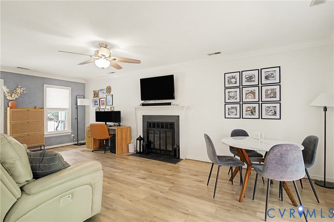 1506 Porters Mill Terrace, Smoketree South, Midlothian, VA 23114 Wood-finish flooring throughout, ceiling fan with integrated lighting, built-in fireplace, and a dining area