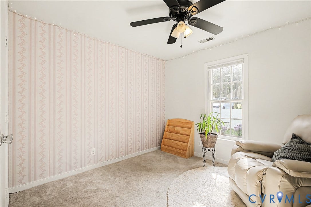 1506 Porters Mill Terrace, Smoketree South, Midlothian, VA 23114 Carpeted room featuring a ceiling fan with integrated lighting, a double-hung window, and a wall with striped wallpaper