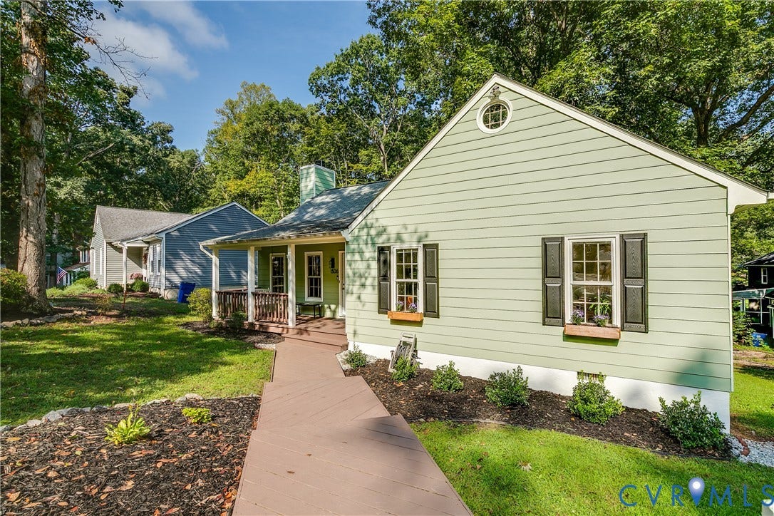1506 Porters Mill Terrace, Smoketree South, Midlothian, VA 23114 Light green siding with dark shutters, front porch with wood railings, and a front walkway