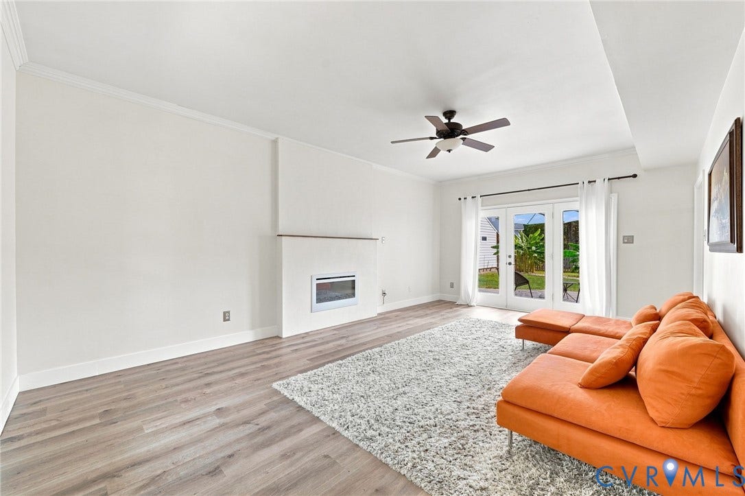 4509 Vienna Woods Place, Innsbrook, Henrico, VA 23060 Hardwood-finish flooring, built-in fireplace, ceiling fan, and French doors leading to a private outdoor area