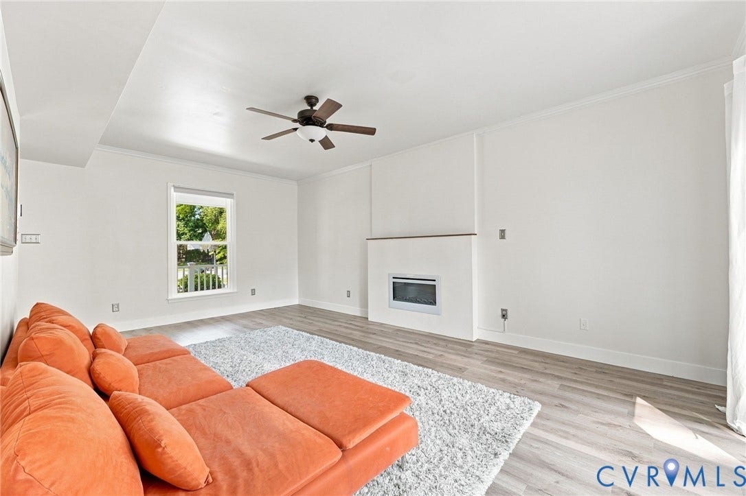 4509 Vienna Woods Place, Innsbrook, Henrico, VA 23060 Wood-finish flooring throughout, complemented by a contemporary wall-mounted electric fireplace