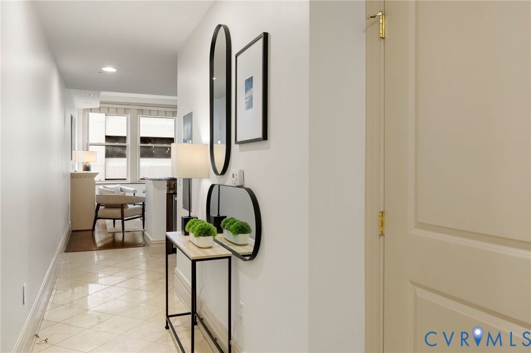 6 N 6th Street, #U5B, Downtown/Financial District, Richmond, VA 23219 Hallway featuring recessed lighting, paneled interior door with brass hardware, and tiled flooring