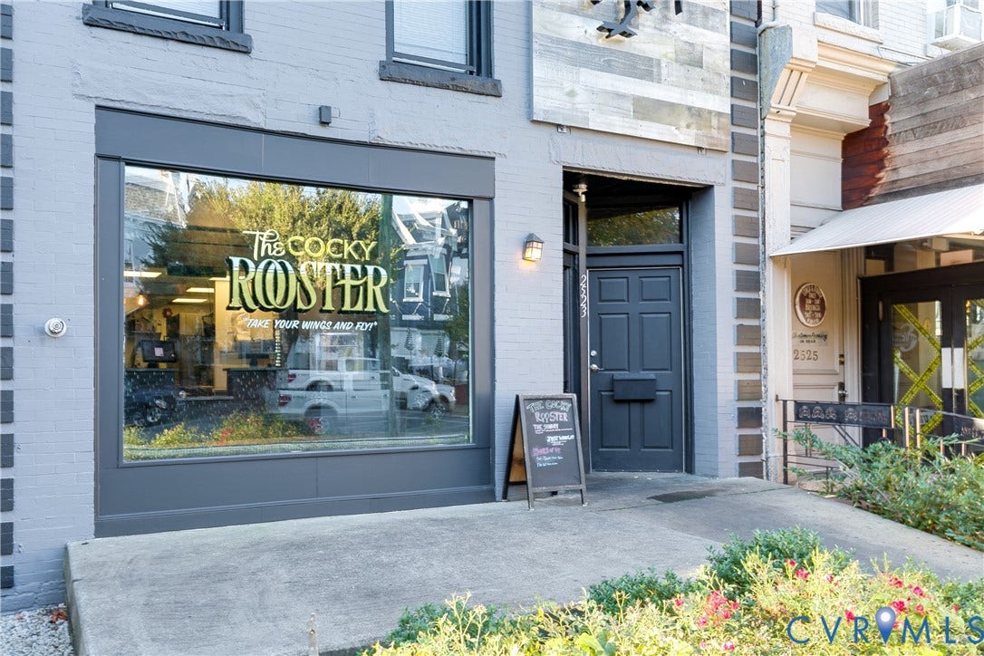 2523 W Main Street, The Fan, Richmond, VA 23220 Exterior with a painted brick facade, large storefront window, paneled entry door, and concrete walkway