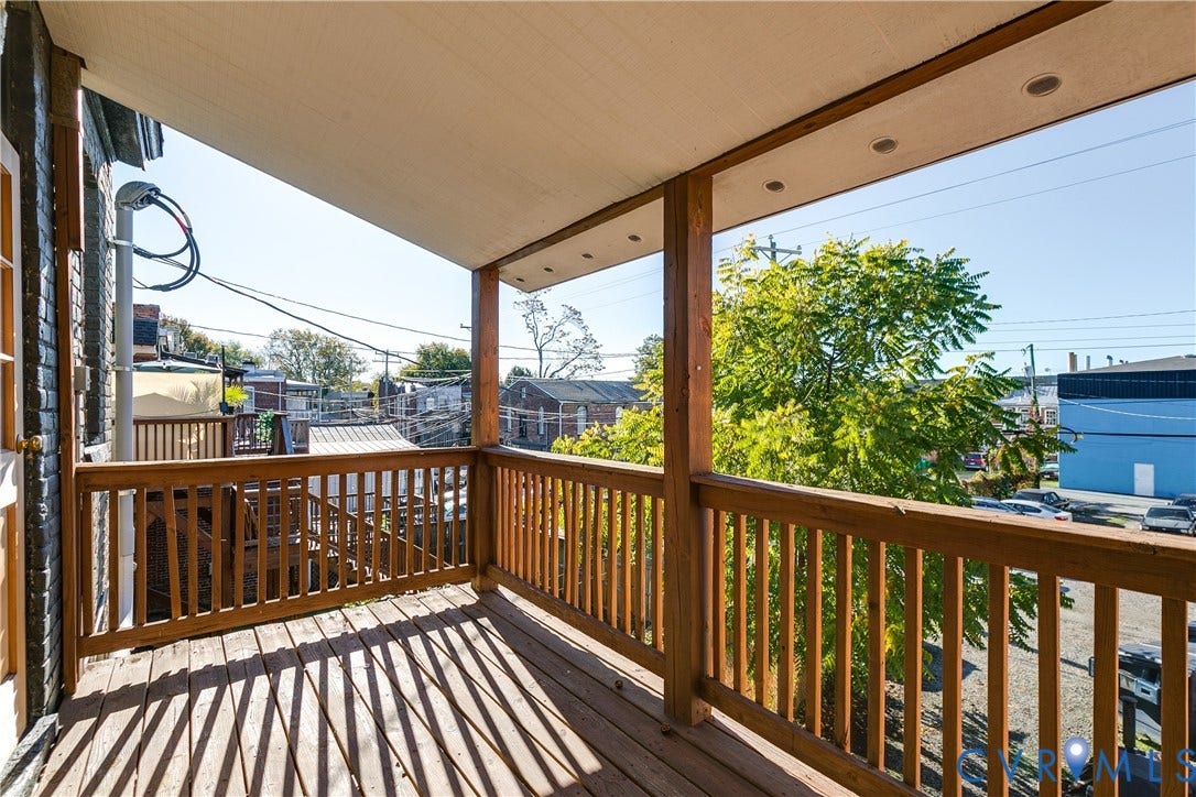 2523 W Main Street, The Fan, Richmond, VA 23220 Wooden deck with slatted railing and overhead lighting