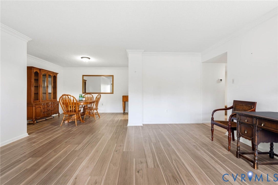 2956 Hathaway Road, #U407, Richmond, VA 23225 Wood-finish flooring throughout, white walls, and crown molding