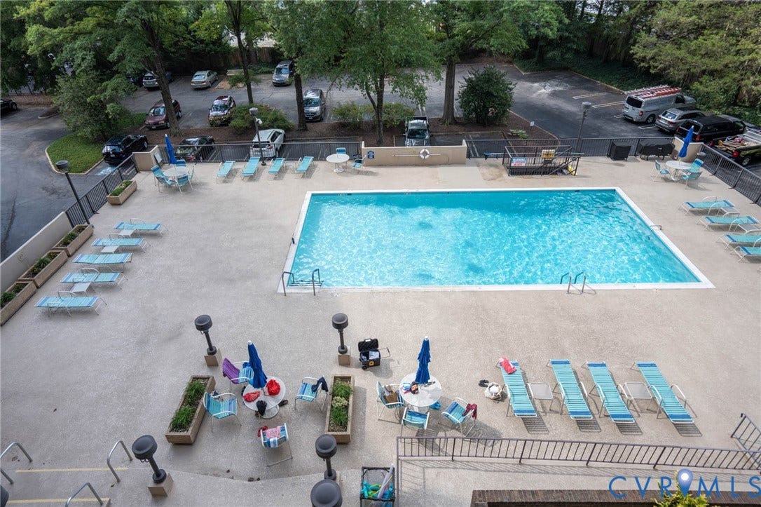 2956 Hathaway Road, #U407, Richmond, VA 23225 Expansive outdoor pool with a surrounding concrete deck