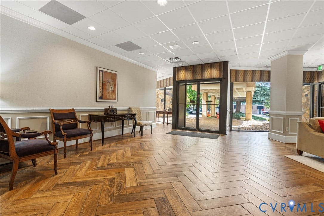 2956 Hathaway Road, #U407, Richmond, VA 23225 Herringbone wood-finish flooring, wainscoting, recessed lighting, drop ceiling, and glass entry doors