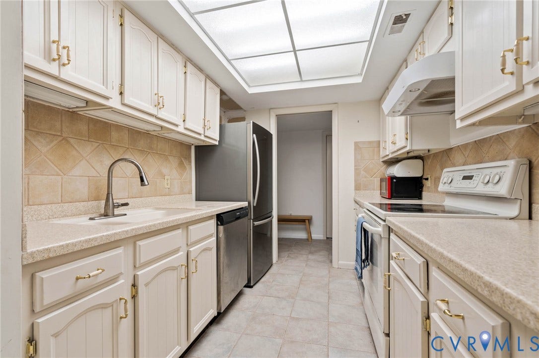 2956 Hathaway Road, #U407, Richmond, VA 23225 Kitchen featuring white cabinetry, light-toned countertops, a tiled backsplash, and recessed ceiling lighting