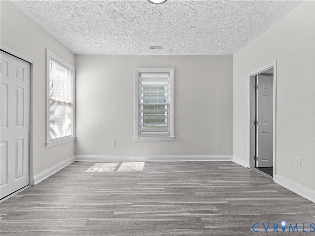3059 Decatur Street, Richmond, VA 23224 Primary bedroom with ensuite full bathroom and closet.