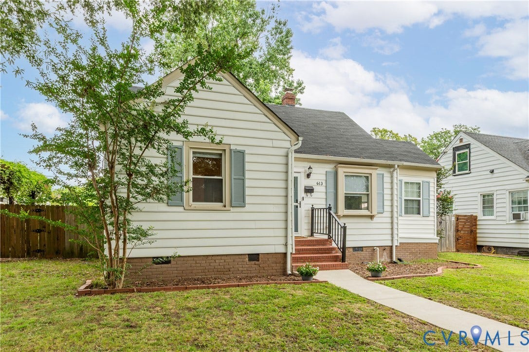 613 Rothesay Road, City Stadium, Richmond, VA 23221 White siding exterior with a dark-shingled roof, red brick foundation, and light blue window shutters