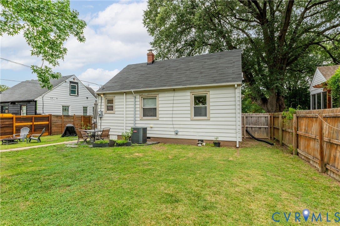 613 Rothesay Road, City Stadium, Richmond, VA 23221 Expansive backyard with a flat lawn, featuring a patio area, and perimeter fencing