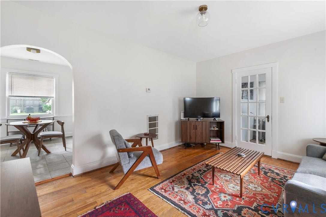 613 Rothesay Road, City Stadium, Richmond, VA 23221 Wood-finish flooring, white painted walls, and an arched doorway