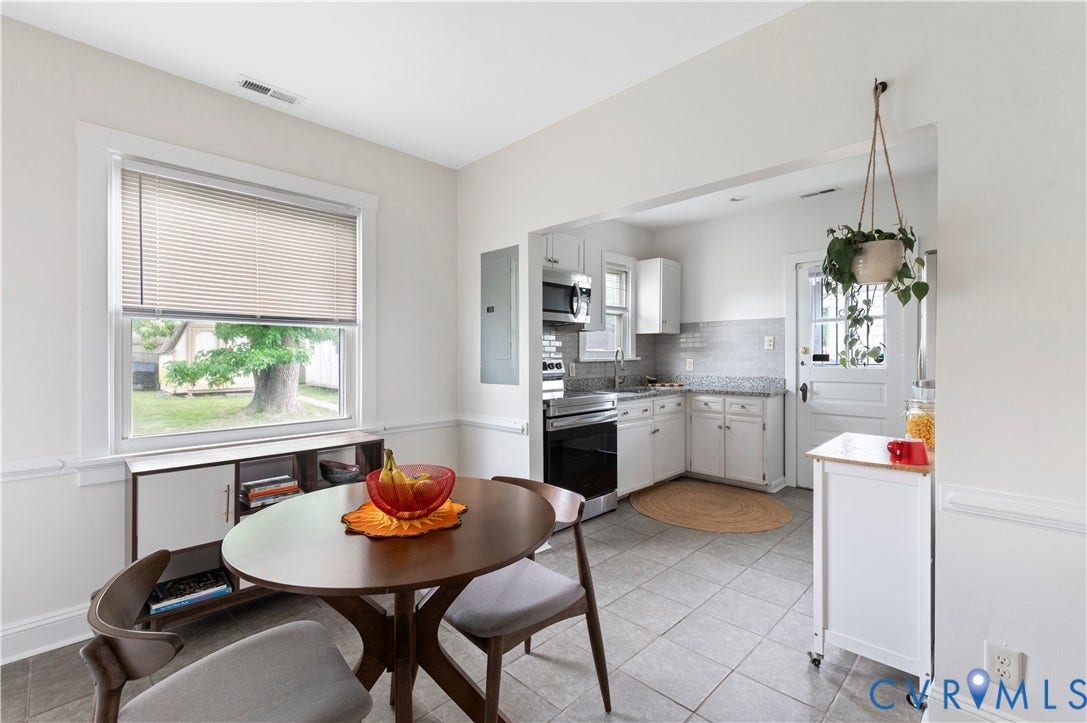 613 Rothesay Road, City Stadium, Richmond, VA 23221 Bright dining area with a double-hung window, white interior trim, and wainscoting