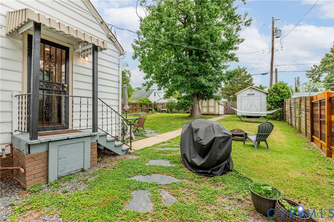 613 Rothesay Road, City Stadium, Richmond, VA 23221 Rear exterior featuring a covered porch, wood siding, and stone pathway