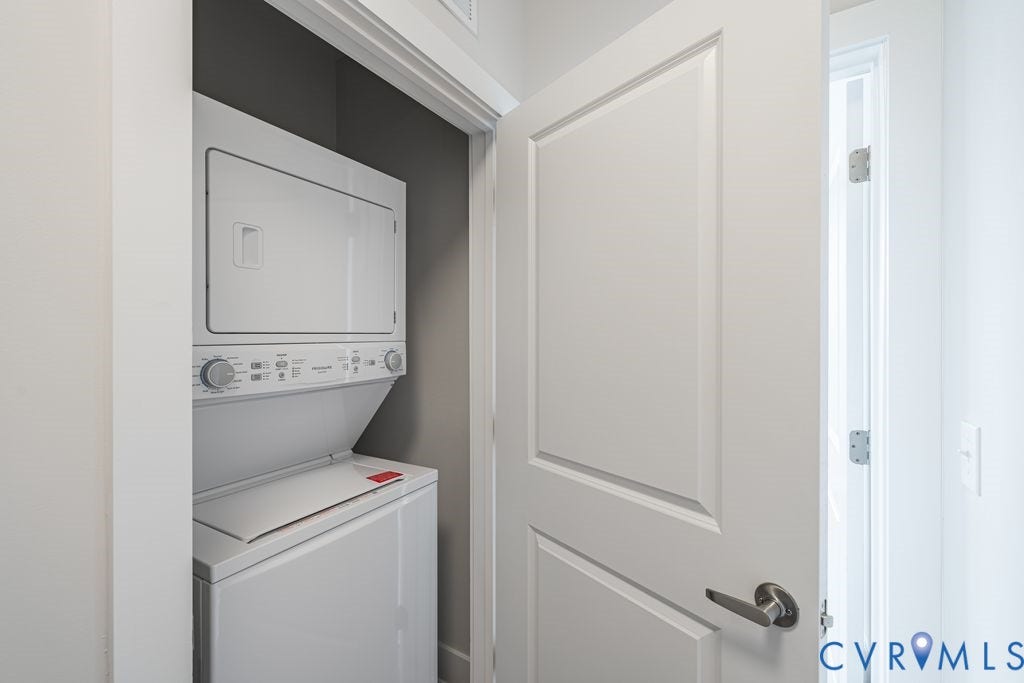 10530 Stony Bluff Drive, #102, Stony Run Condos, Ashland, VA 23005 White stacked washer and dryer unit with a paneled door