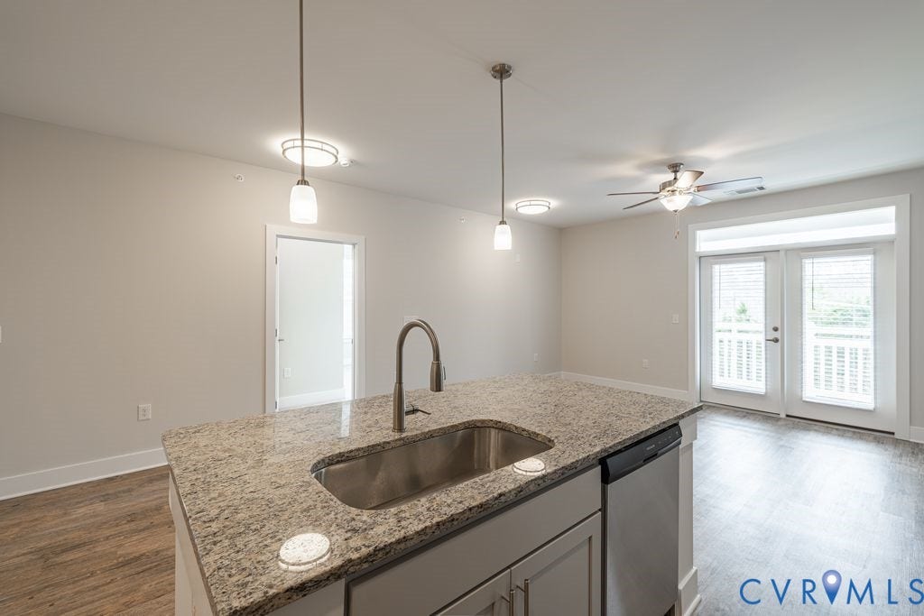 10530 Stony Bluff Drive, #102, Stony Run Condos, Ashland, VA 23005 Kitchen island with a stainless steel sink and granite countertop