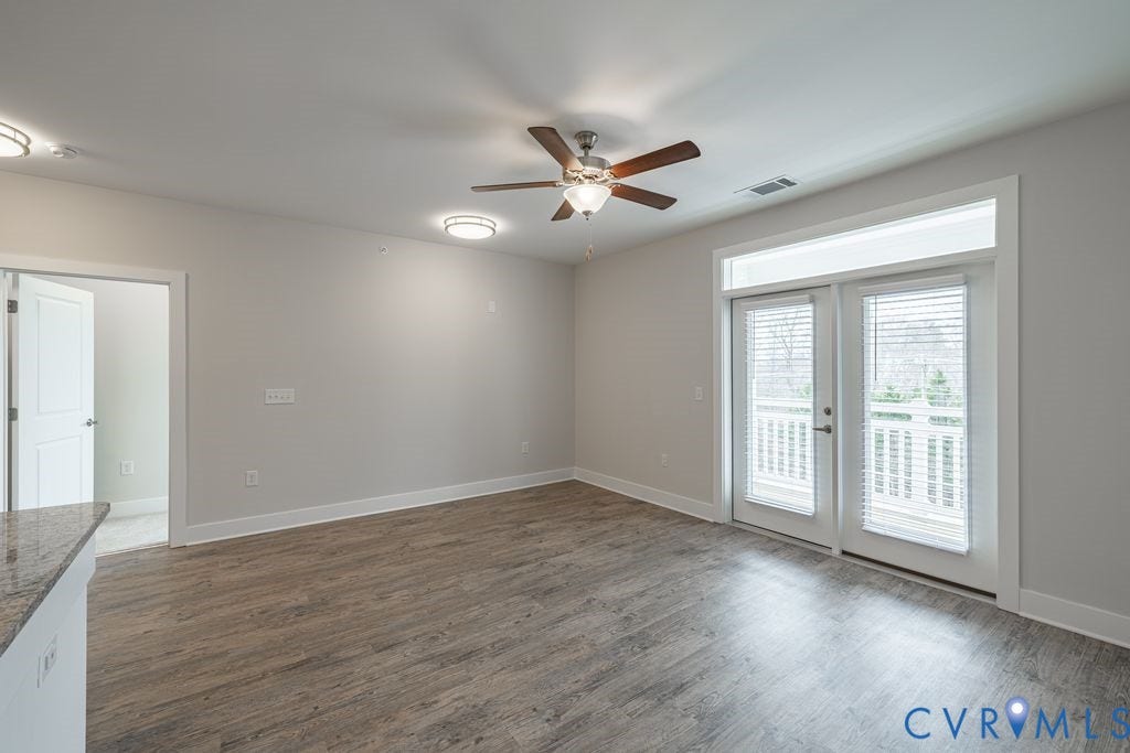 10530 Stony Bluff Drive, #102, Stony Run Condos, Ashland, VA 23005 Wood-finish flooring, ceiling fan with integrated lighting, recessed lighting, double doors with transom window, and a built-in countertop