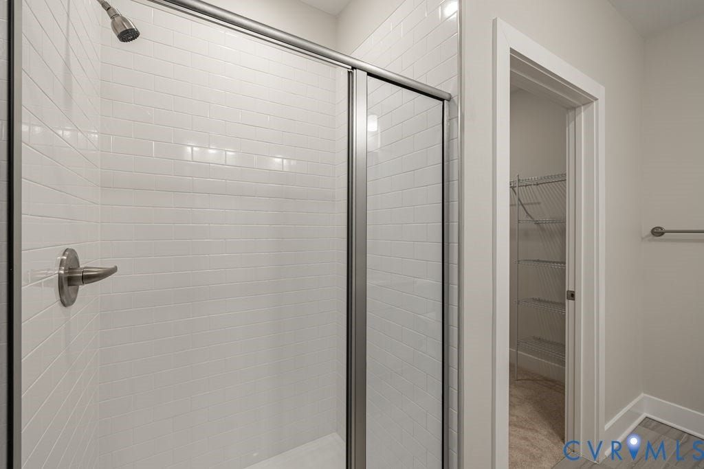 10530 Stony Bluff Drive, #102, Stony Run Condos, Ashland, VA 23005 Glass-enclosed shower with subway tile surround, brushed nickel hardware, and a rainfall showerhead