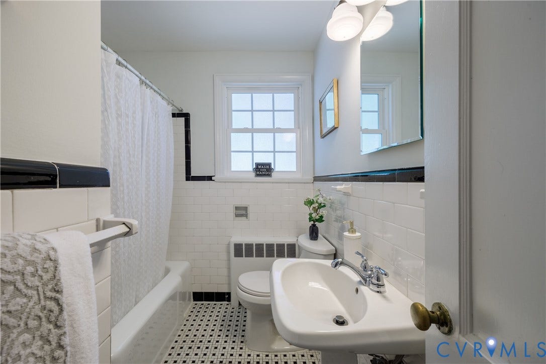 4919 Park Avenue, Near West End, Richmond, VA 23226 White subway tile walls with black trim, pedestal sink, chrome fixtures, built-in tub with shower, and checkered floor tile