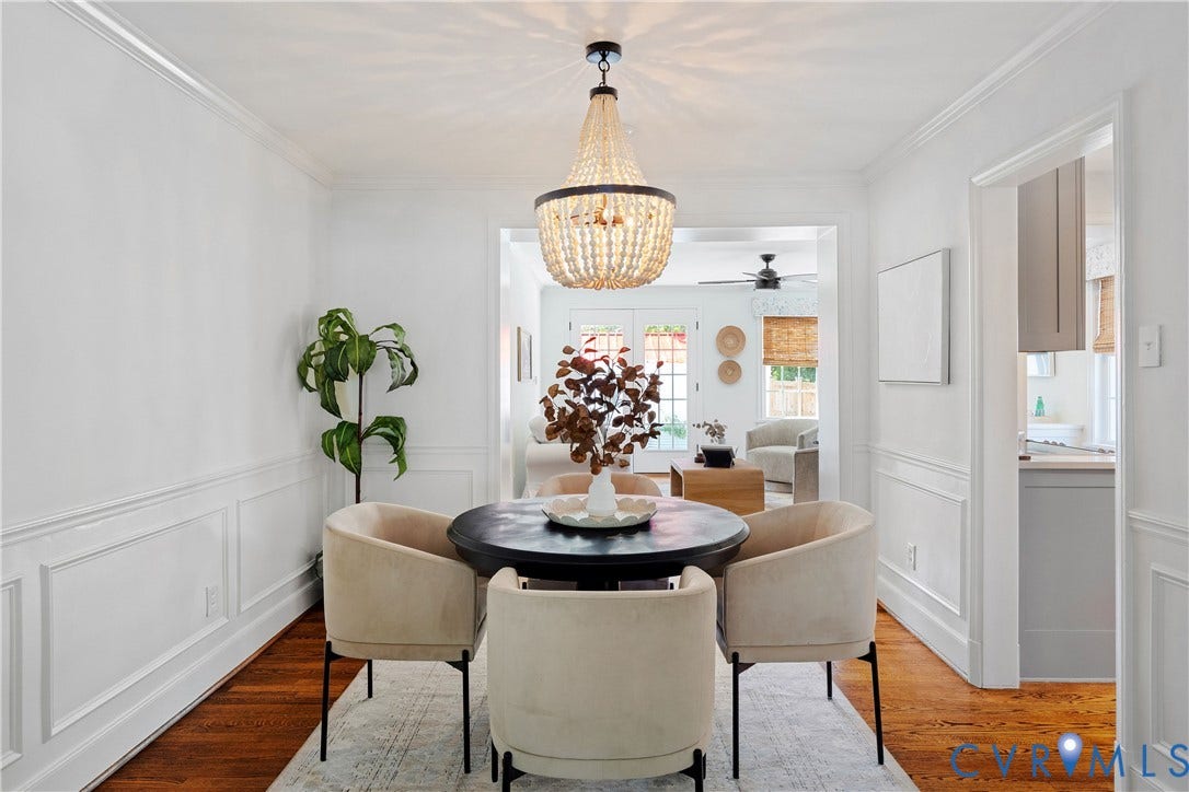 4919 Park Avenue, Near West End, Richmond, VA 23226 Hardwood flooring throughout, elegant beaded chandelier, white wainscoting, crown molding, and a wide cased opening