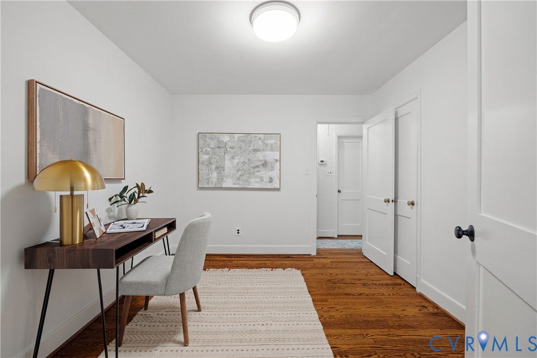 4919 Park Avenue, Near West End, Richmond, VA 23226 Hardwood flooring, white painted walls, and a flush mount ceiling light