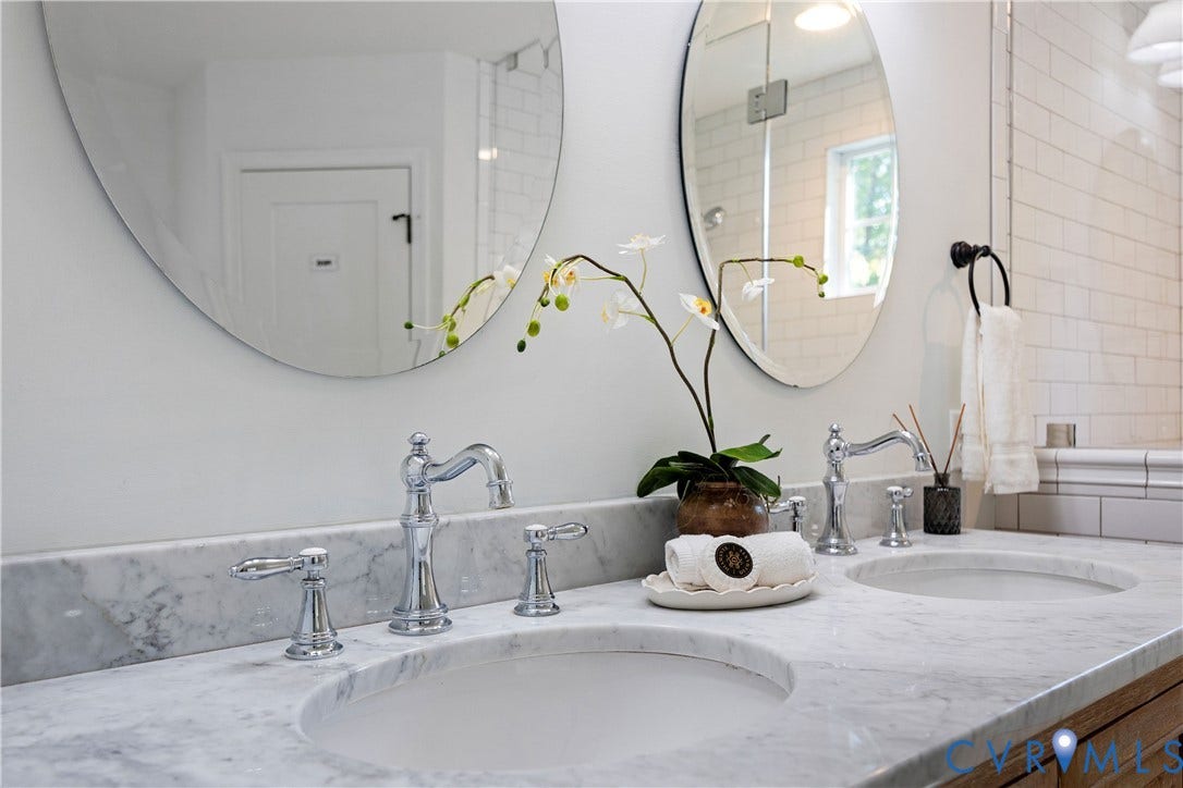4919 Park Avenue, Near West End, Richmond, VA 23226 Dual vanity with integrated sinks, marble countertop, and polished chrome fixtures
