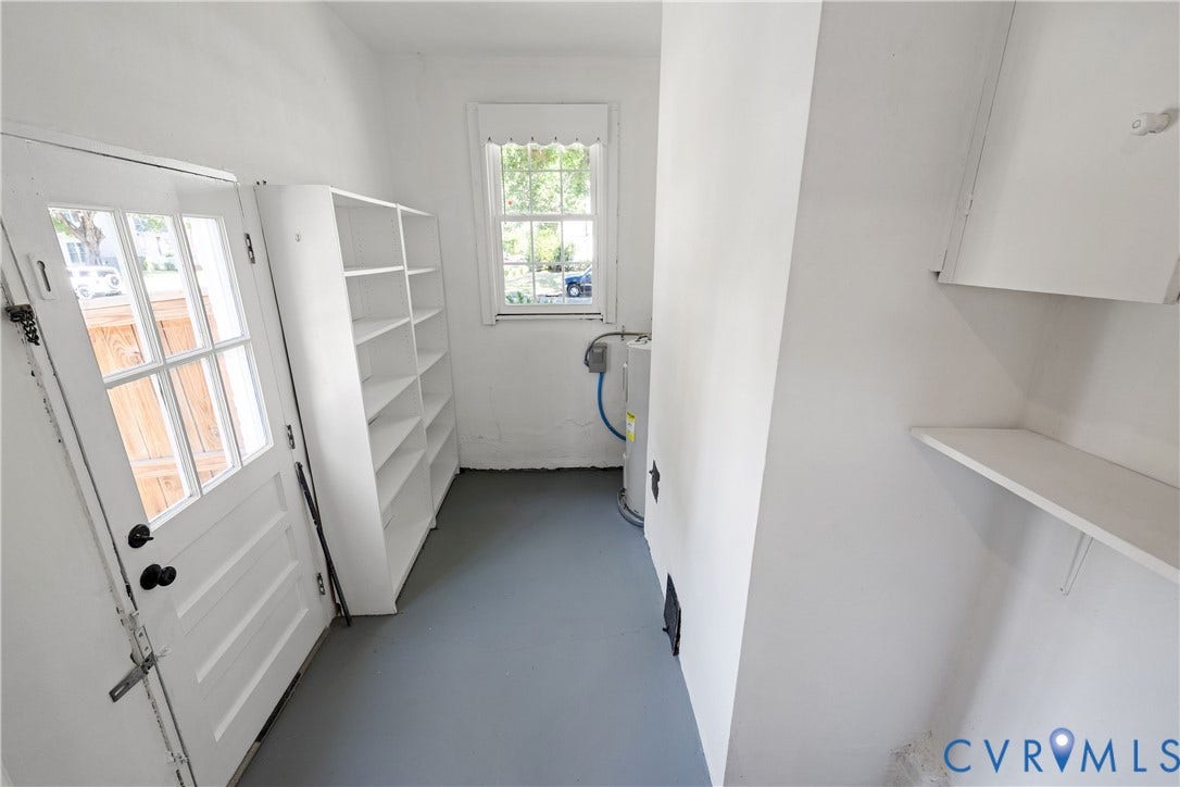 4919 Park Avenue, Near West End, Richmond, VA 23226 Built-in shelving, paneled door with glass inserts, and a window providing natural light