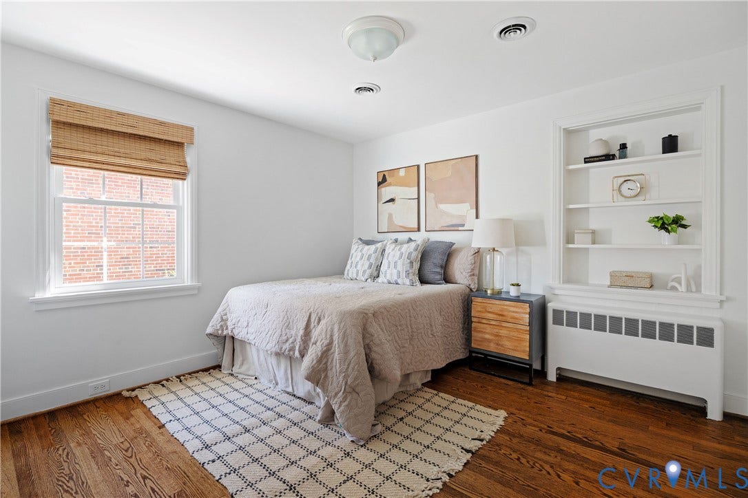 4919 Park Avenue, Near West End, Richmond, VA 23226 Hardwood flooring, built-in shelving, white walls, and a double-hung window