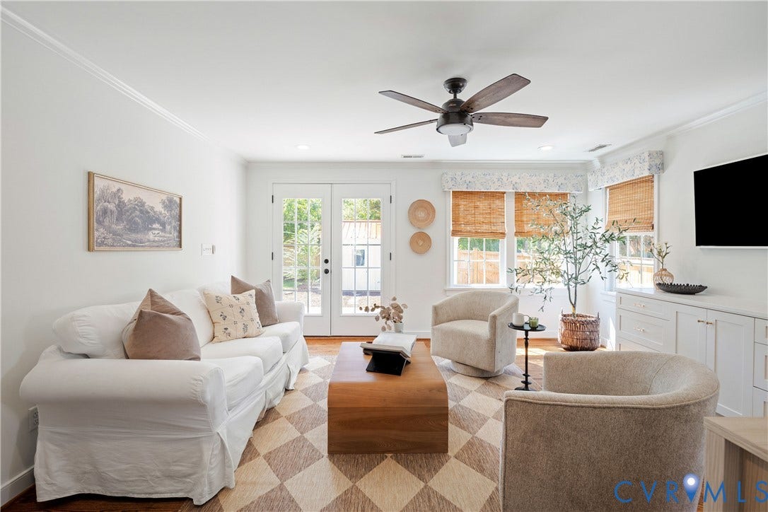4919 Park Avenue, Near West End, Richmond, VA 23226 Dual pane French patio doors, wood-finish flooring, built-in cabinetry, and a ceiling fan with integrated lighting