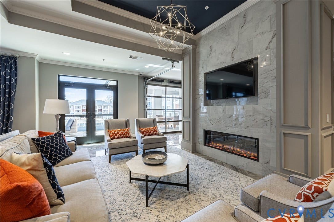 10526 Stony Bluff Drive, #302, Stony Run Condos, Ashland, VA 23005 Marble-patterned accent wall with an integrated linear fireplace