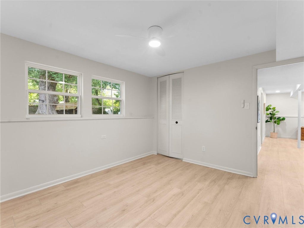 5907 Stella Road, Richmond, VA 23234 Light wood-finish flooring, white walls, and a ceiling fan
