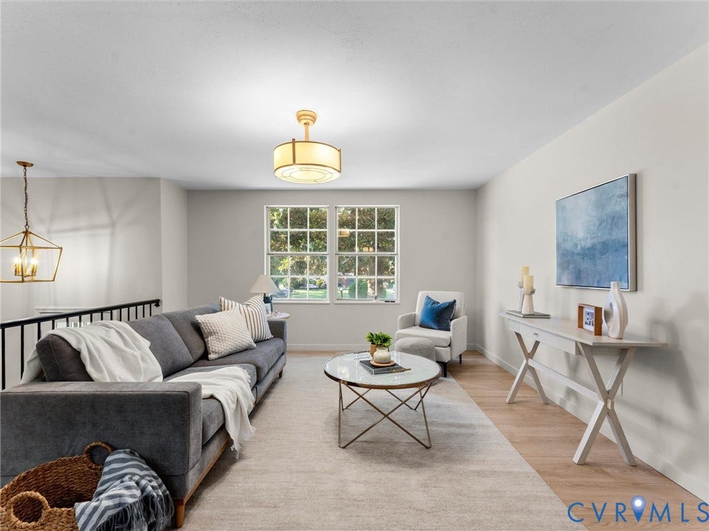 5907 Stella Road, Richmond, VA 23234 Light-colored wood-finish flooring, white walls, and a large window with muntins