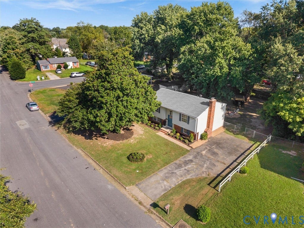 5907 Stella Road, Richmond, VA 23234 Well-maintained exterior with a grey shingle roof and a brick chimney