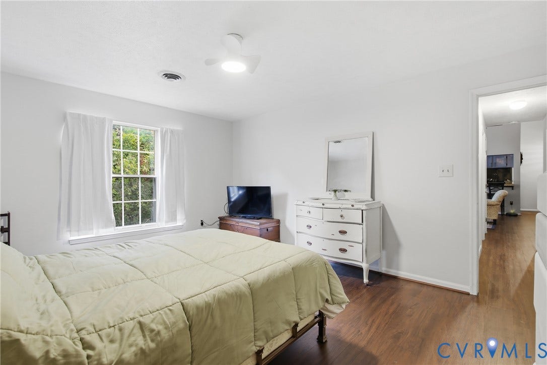 LVP flooring and ceiling fan with a light