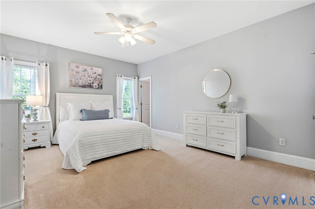 First Floor Bedroom with a ceiling fan, multiple windows, and ensuite to Full Bathroom
