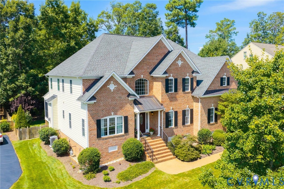 Brick and siding exterior with a multi-level roofline