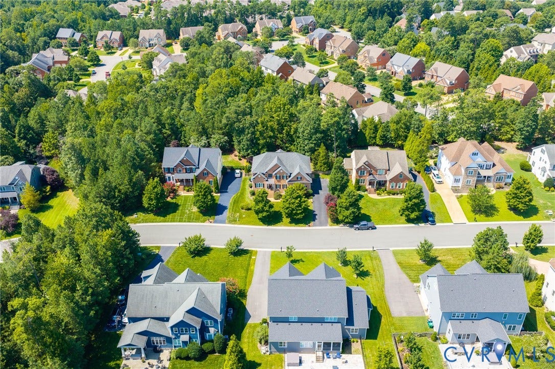 Spacious residential neighborhood featuring mature trees and multiple individual properties