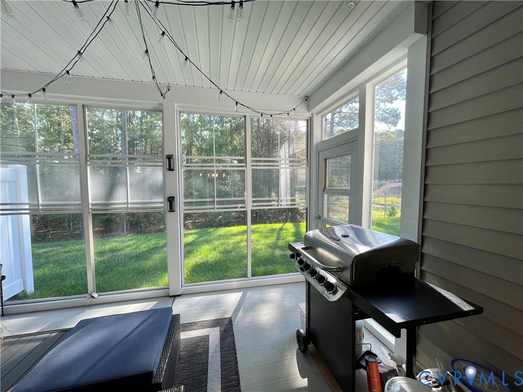 6905 Leire Lane, Chesterfield, VA 23832 Screened-in porch featuring a beadboard ceiling, exterior siding, and a door providing access to the yard