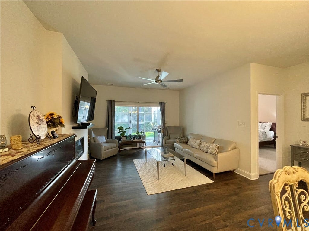 6905 Leire Lane, Chesterfield, VA 23832 Wood-finish flooring throughout, vaulted ceiling, and recessed electric fireplace