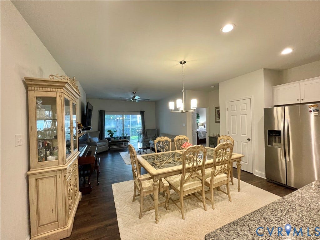 6905 Leire Lane, Chesterfield, VA 23832 Open-concept living space with wood-finish flooring, recessed lighting, and a contemporary chandelier