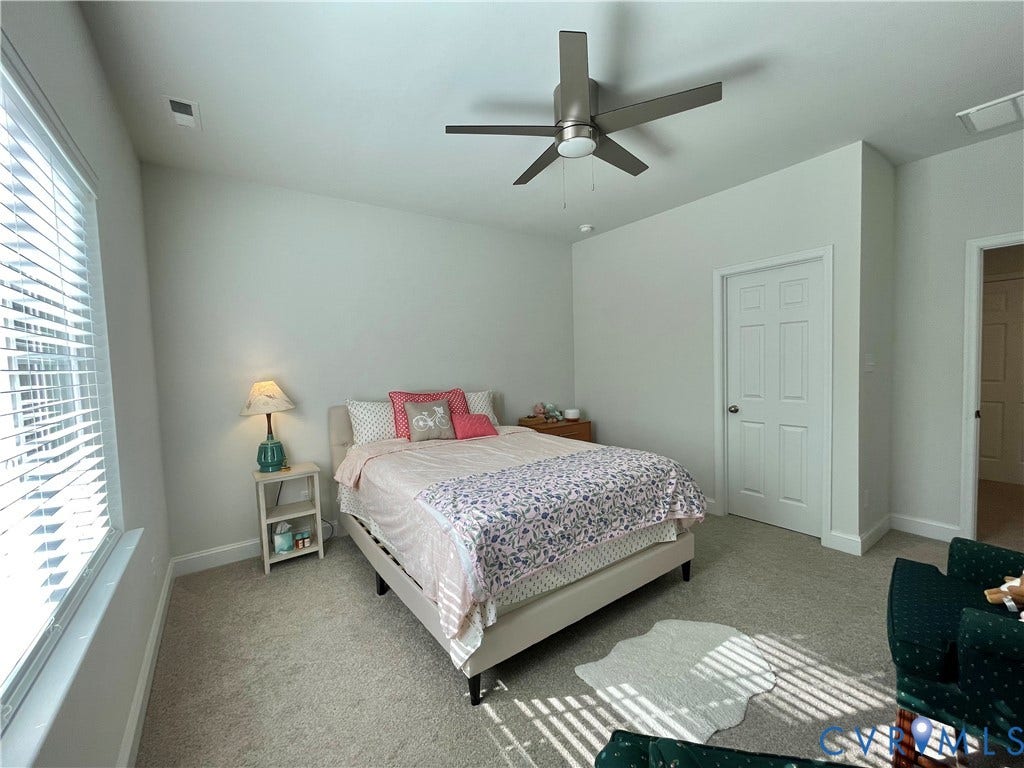 6905 Leire Lane, Chesterfield, VA 23832 Wall-to-wall carpeting, ceiling fan, white paneled doors, and window with blinds