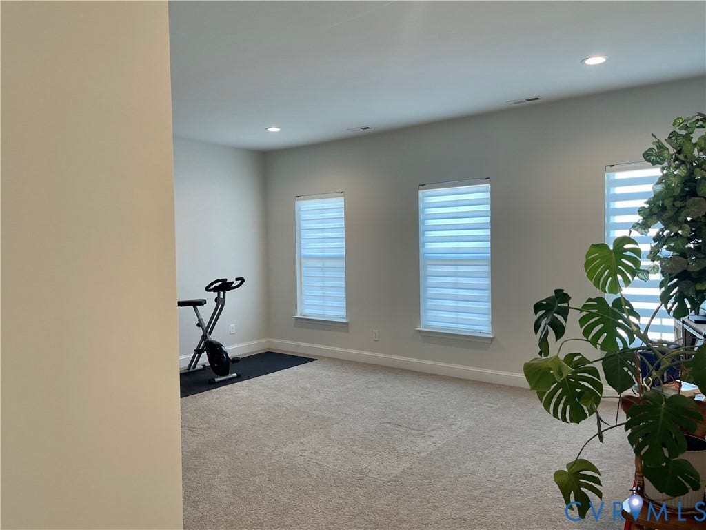 6905 Leire Lane, Chesterfield, VA 23832 Recessed lighting, light-colored carpeting, and multiple windows with blinds