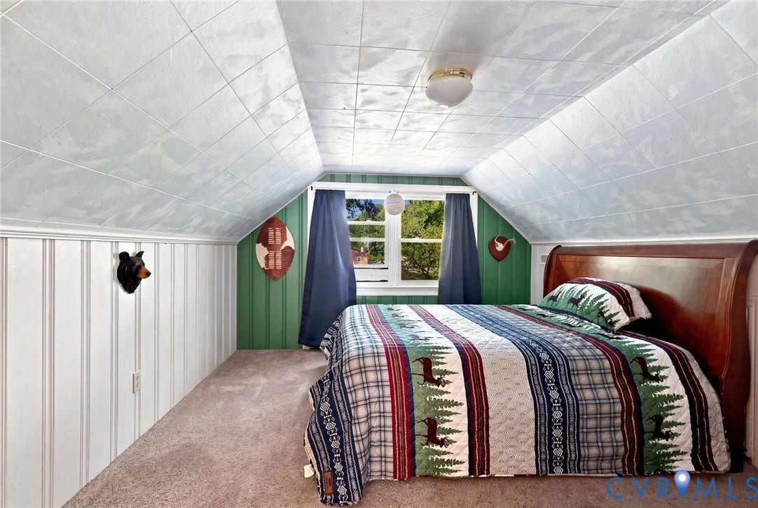 Bedroom 4 Upstairs, Built-in Dresser behind bed, Sloped ceiling with acoustic tiles, plush carpet flooring, beadboard wall paneling,