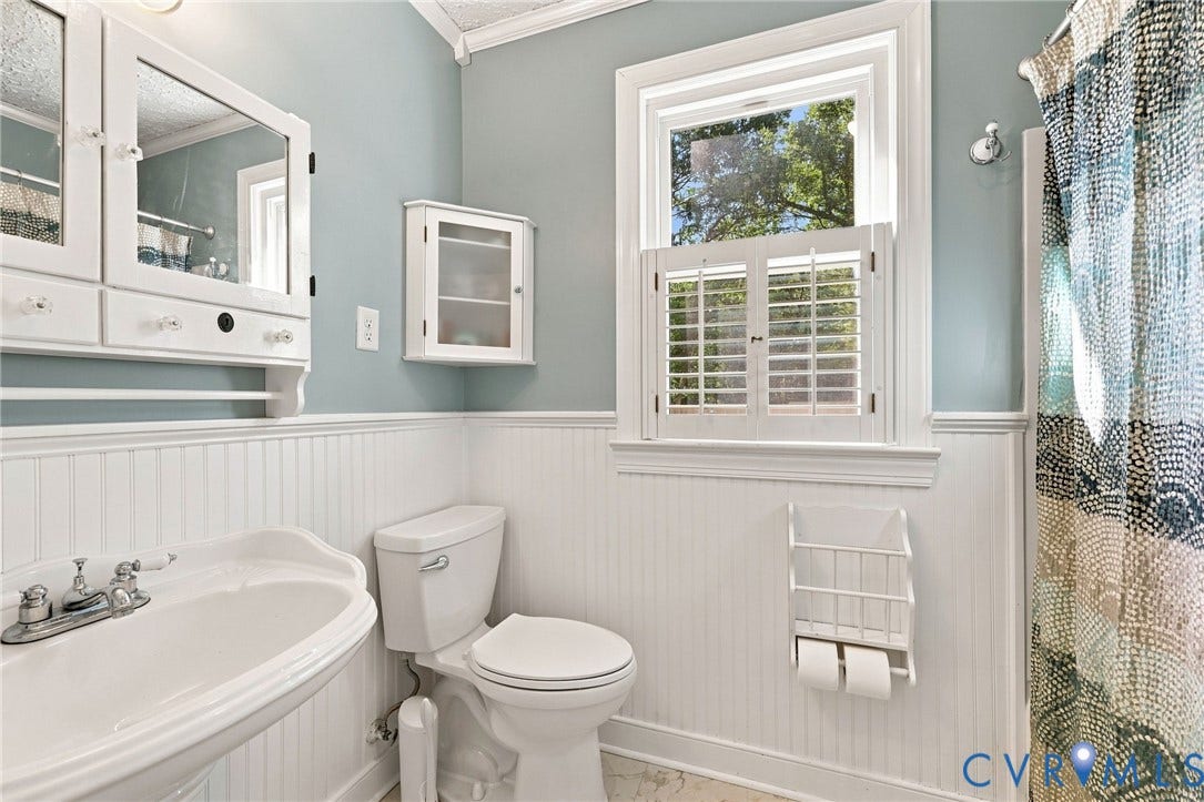 New shower/tub, wainscoting, privacy shutters