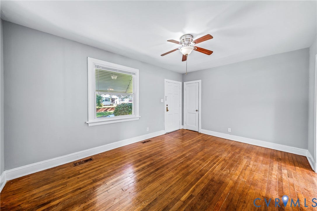 Hardwood flooring, painted walls, ceiling fan with light fixture, and white trim